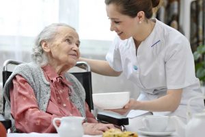 malnourishment nursing home abuse - caregiver and elderly lady pic