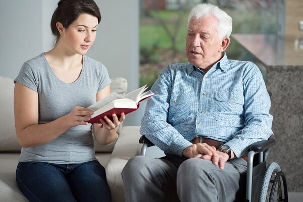 Reading a book with an Elderly Resident