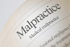 Medical malpractice definition in a law book owned by an attorney in Florida.