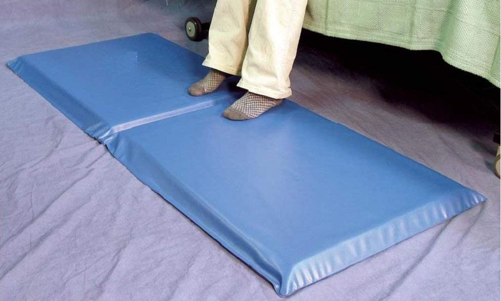 Nursing home floor mat by the bed prevents broken bones